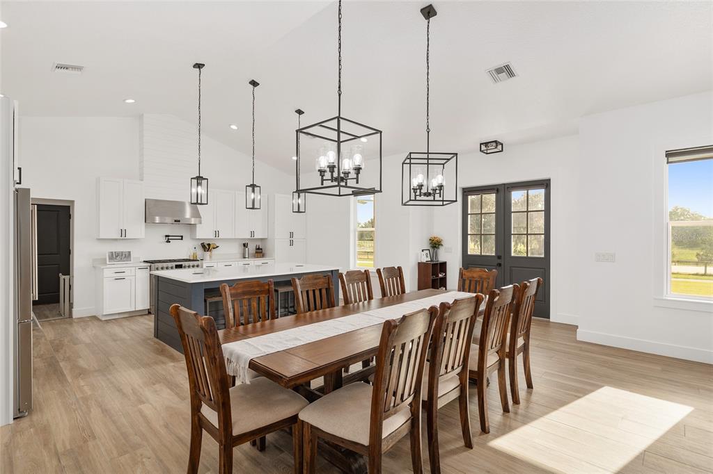 15224 Northwest 56th Court Road Reddick, FL 32686 - Photo 19 of 50 a view of a dining room furniture and windows