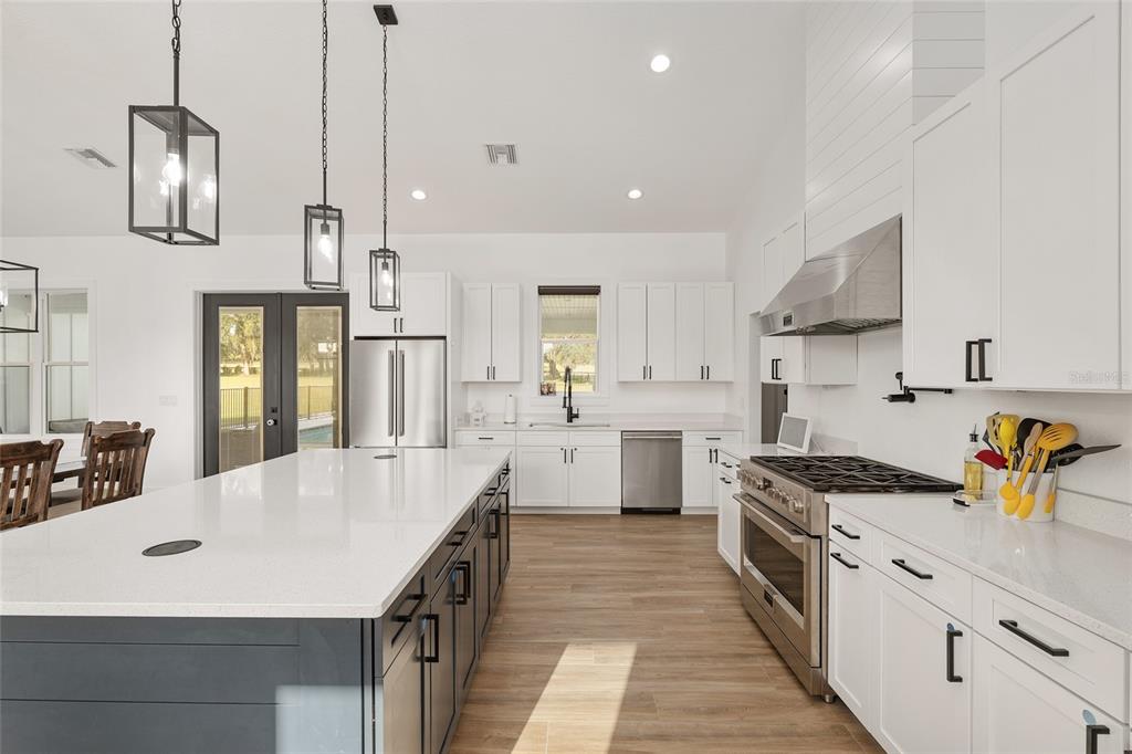 15224 Northwest 56th Court Road Reddick, FL 32686 - Photo 23 of 50 a kitchen with granite countertop a sink a counter space appliances and cabinets