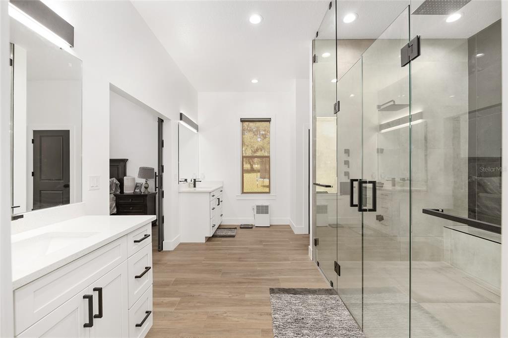 15224 Northwest 56th Court Road Reddick, FL 32686 - Photo 32 of 50 a large bathroom with a glass door shower