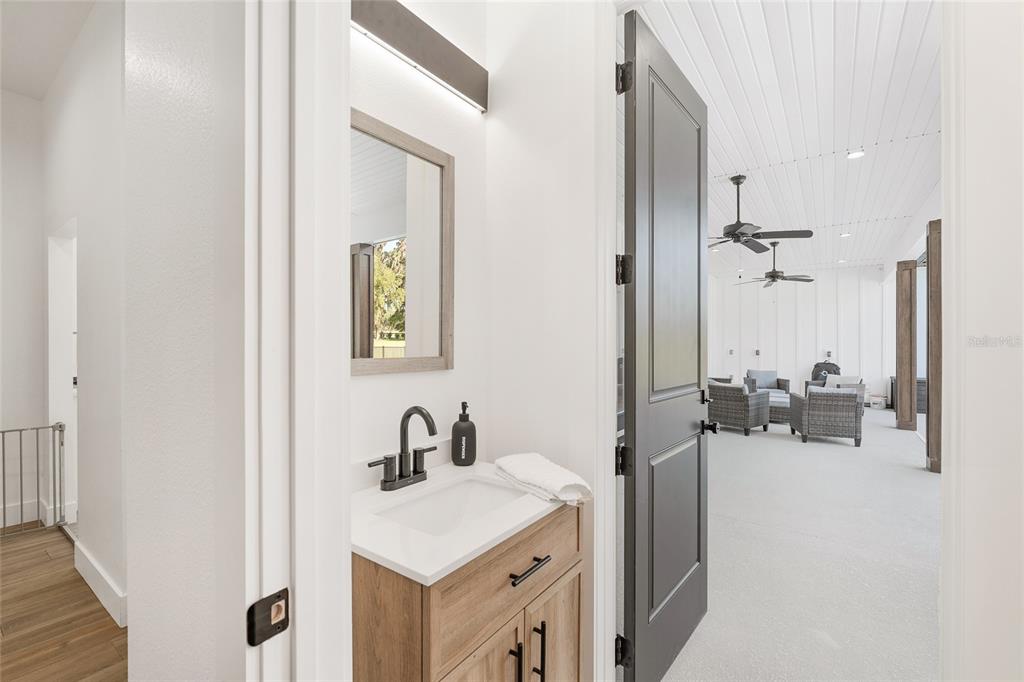 15224 Northwest 56th Court Road Reddick, FL 32686 - Photo 38 of 50 a view of a room that has a mirror and sink in it