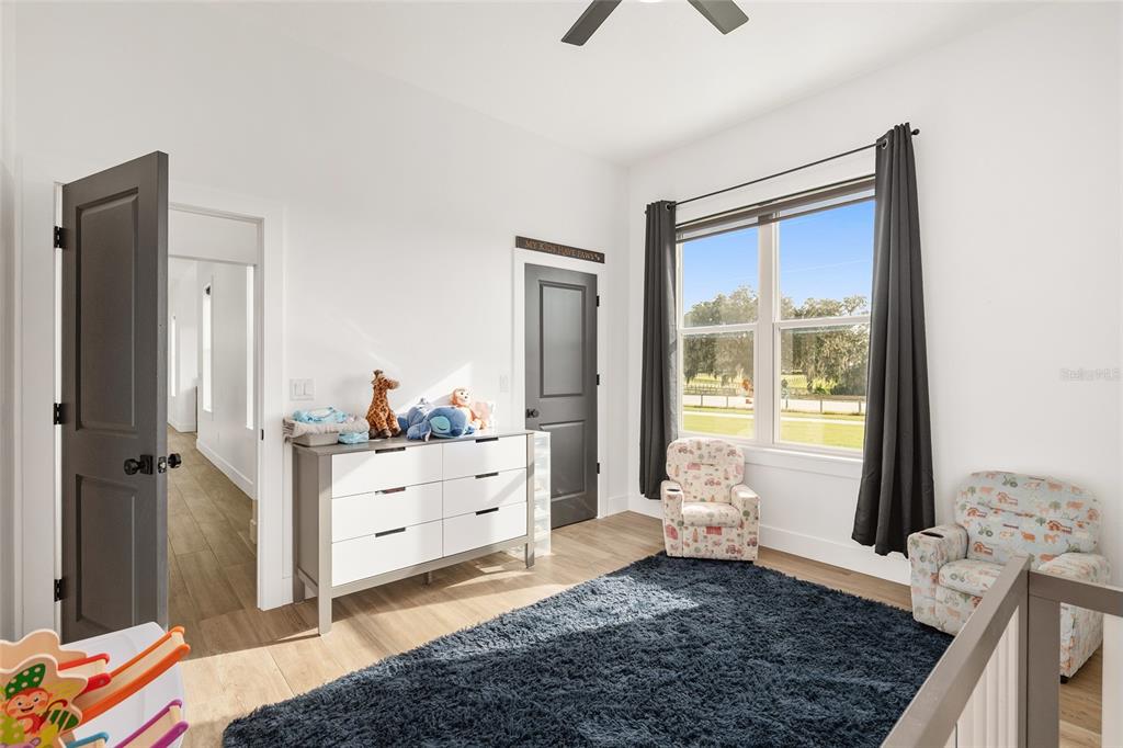 15224 Northwest 56th Court Road Reddick, FL 32686 - Photo 39 of 50 a bed room with a bed and a window