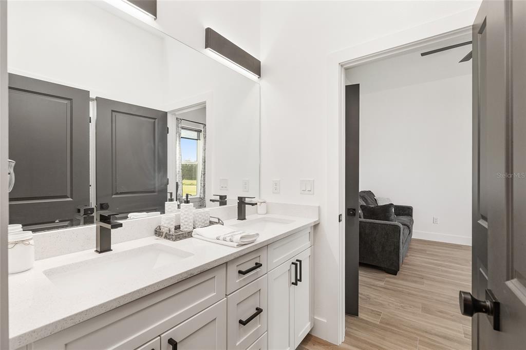 15224 Northwest 56th Court Road Reddick, FL 32686 - Photo 42 of 50 a bathroom with a sink and a mirror