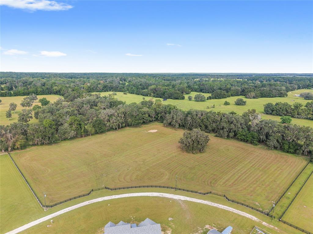 15224 Northwest 56th Court Road Reddick, FL 32686 - Photo 8 of 50 an aerial view of a house with a yard