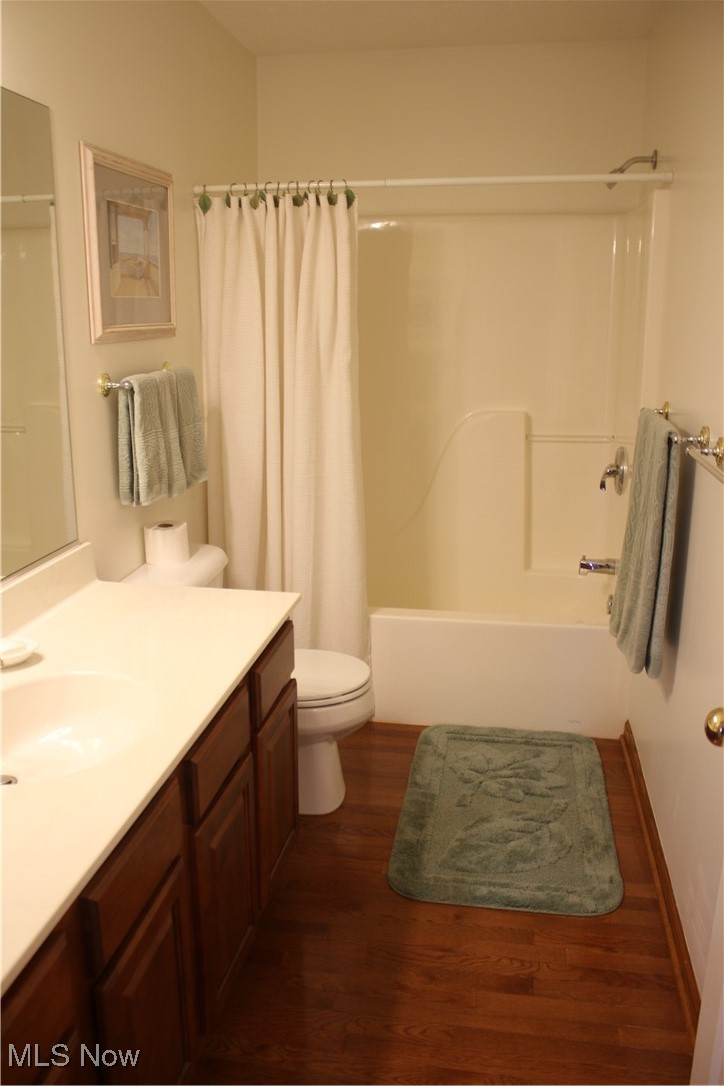 1837 Haines Road Madison, OH 44057 - Photo 22 of 29 Full bath with shower / tub combo, dark wood finished floors, and vanity