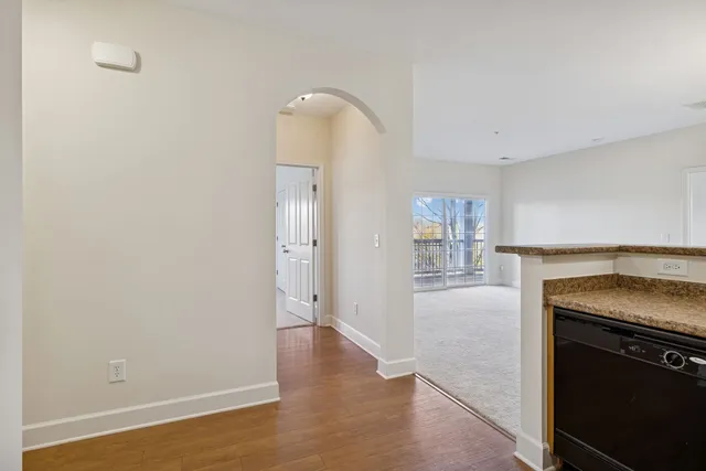 a view of a kitchen cabinets and wooden floor