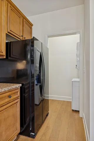 a kitchen with metallic refrigerator freezer and a dishwasher