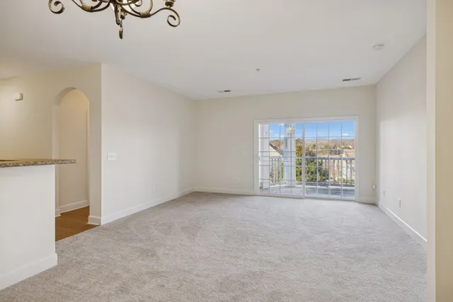 a kitchen with a refrigerator a stove a microwave and cabinets