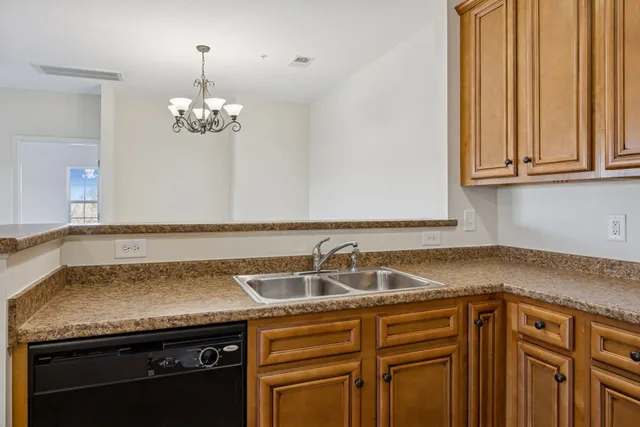 a view of a kitchen sink and dishwasher