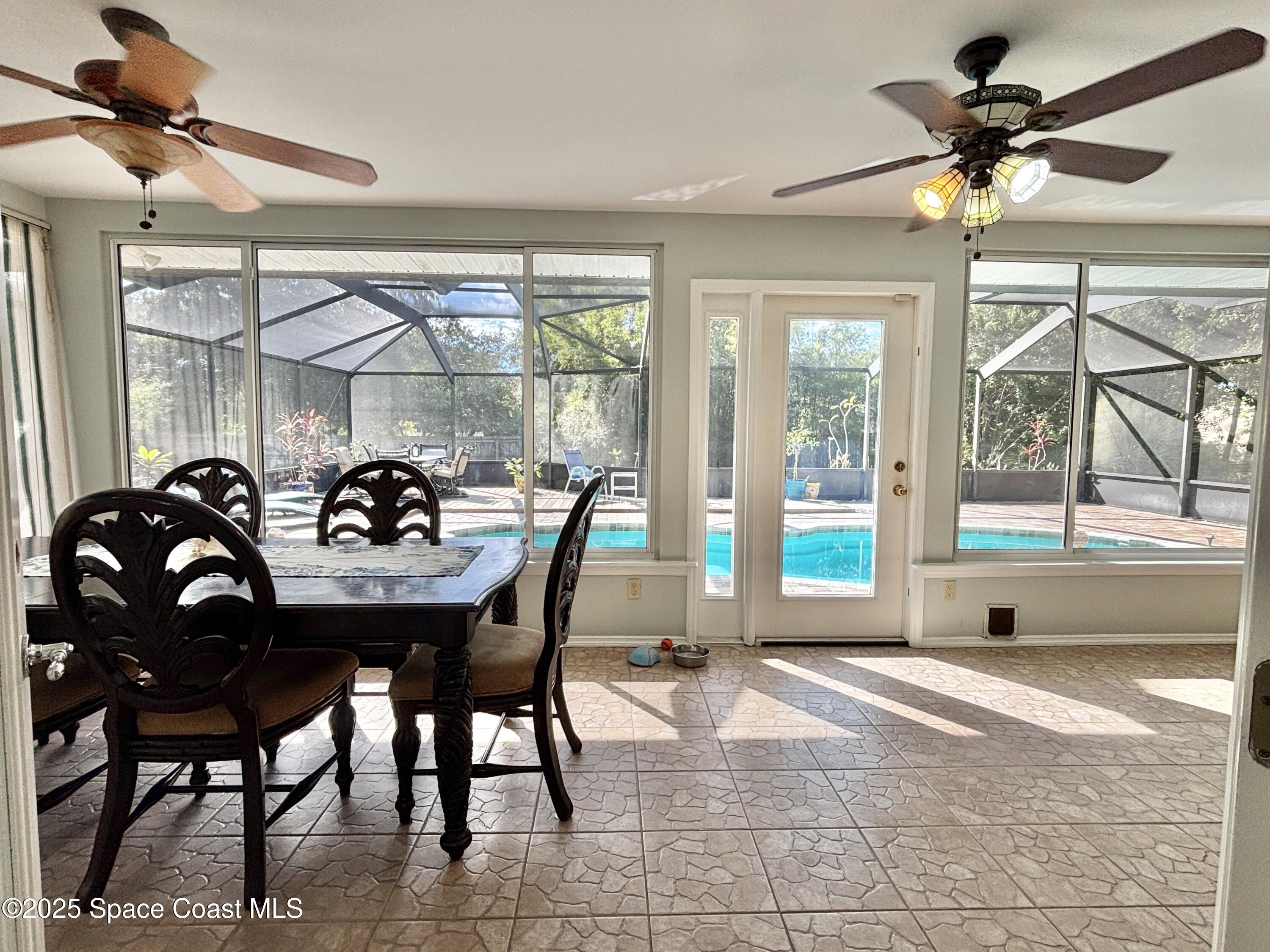 3955 Fooshe Avenue Sebastian, FL 32976 - Photo 13 of 45 a dining room with furniture and window