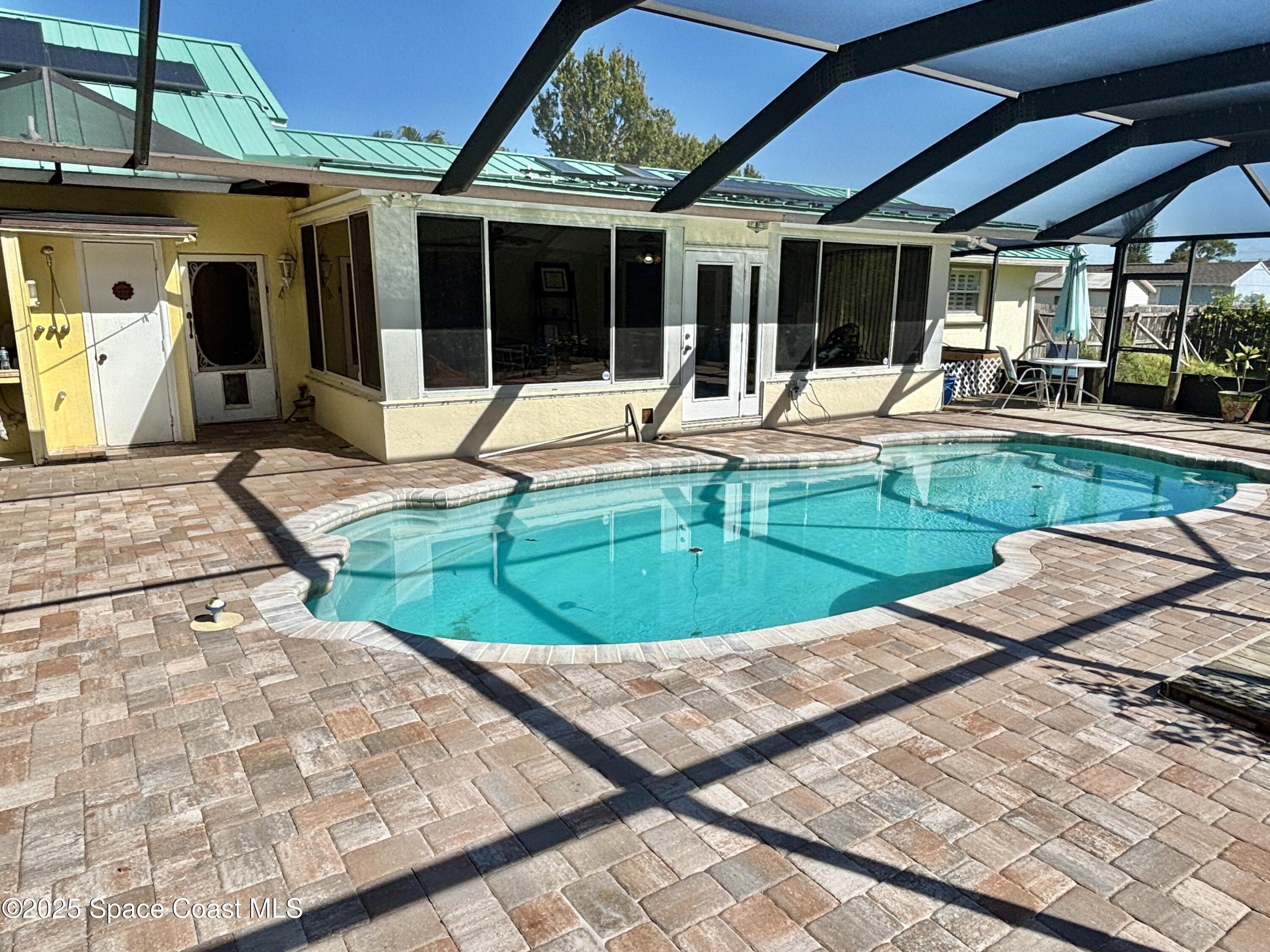 3955 Fooshe Avenue Sebastian, FL 32976 - Photo 29 of 45 a view of a swimming pool with a patio