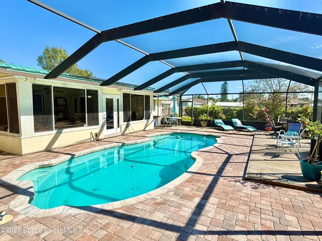 a view of swimming pool with a patio