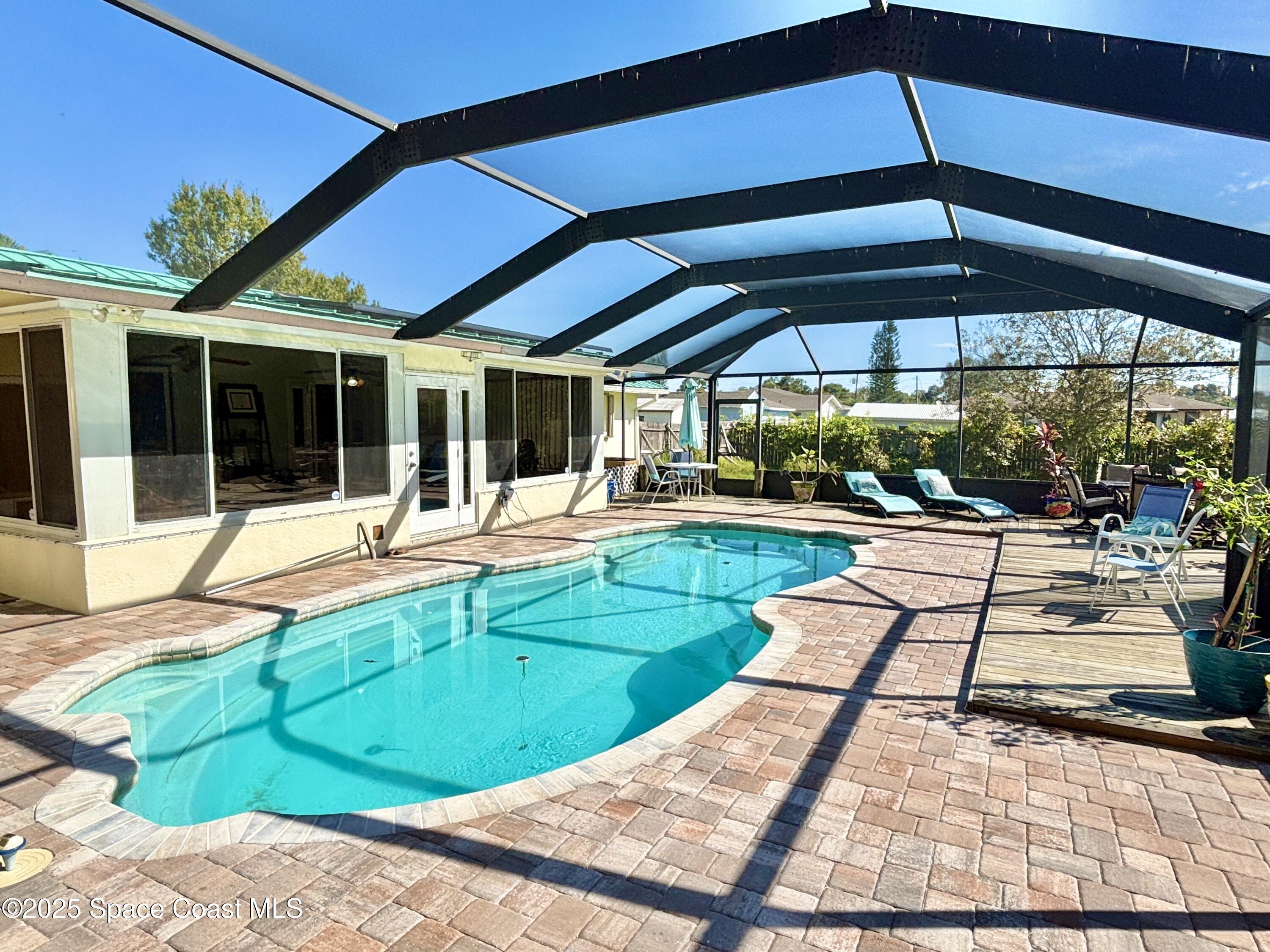 3955 Fooshe Avenue Sebastian, FL 32976 - Photo 30 of 45 a view of a swimming pool with a patio