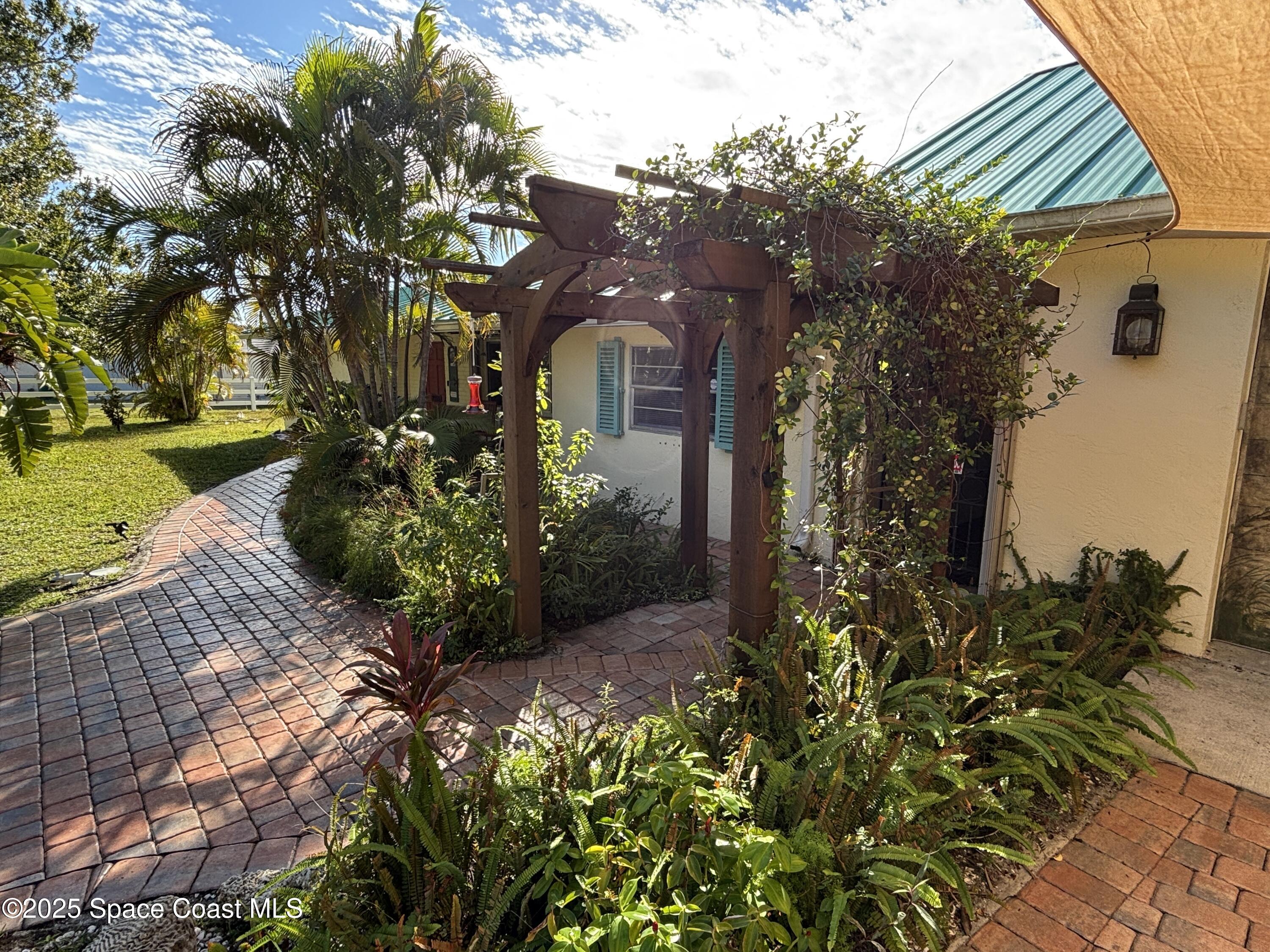 3955 Fooshe Avenue Sebastian, FL 32976 - Photo 3 of 45 a front view of a house with a yard