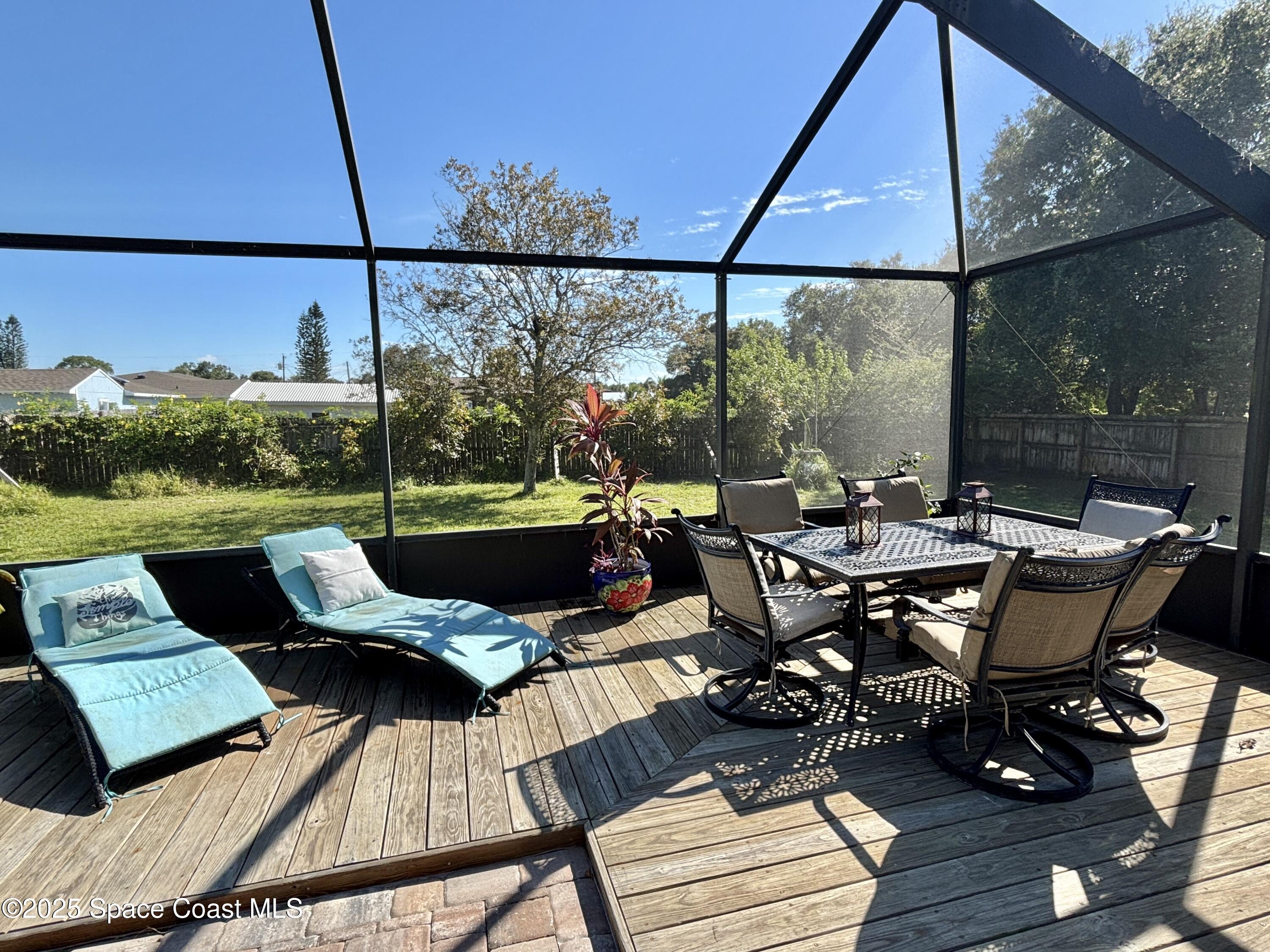 3955 Fooshe Avenue Sebastian, FL 32976 - Photo 33 of 45 a view of a roof deck with table and chairs a barbeque