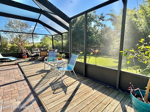 a view of a chairs and table in the patio