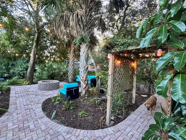 a kitchen with stainless steel appliances granite countertop a sink and wooden cabinets