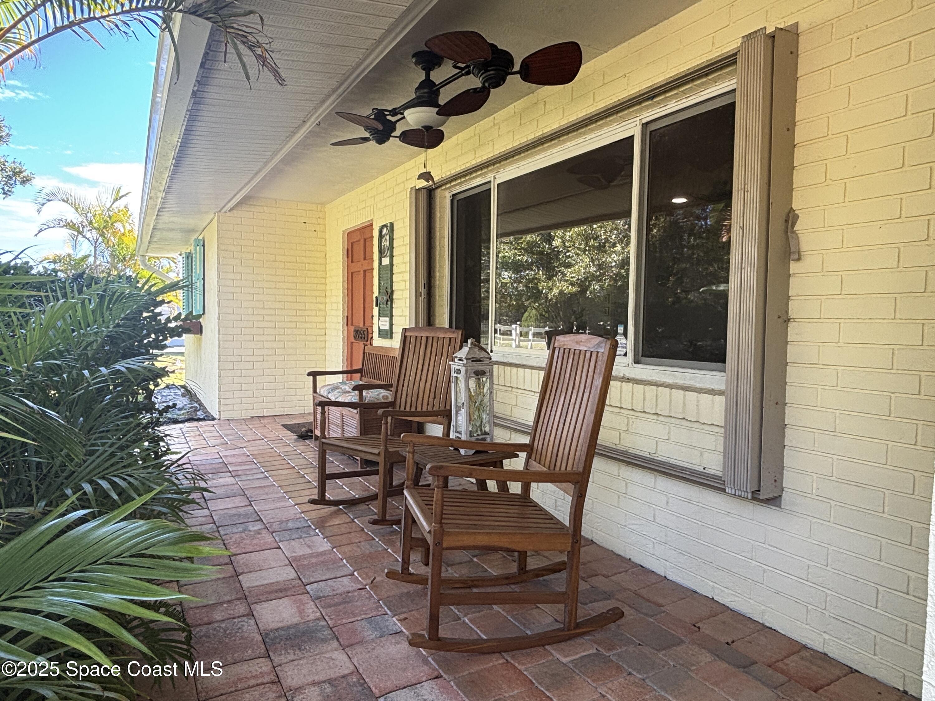3955 Fooshe Avenue Sebastian, FL 32976 - Photo 39 of 45 a view of a patio with table and chairs and potted plants