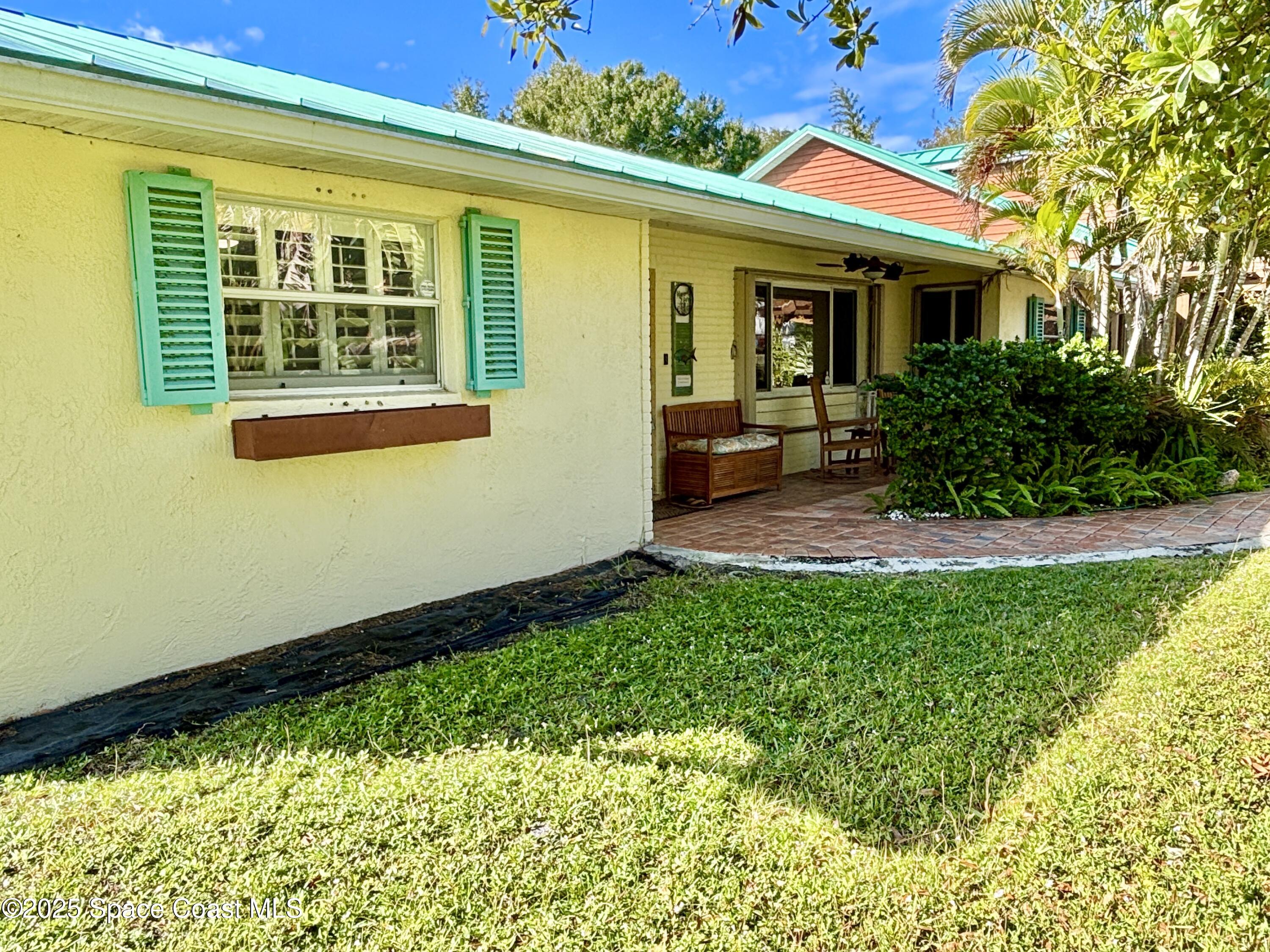 3955 Fooshe Avenue Sebastian, FL 32976 - Photo 4 of 45 a view of backyard with a garden and plants