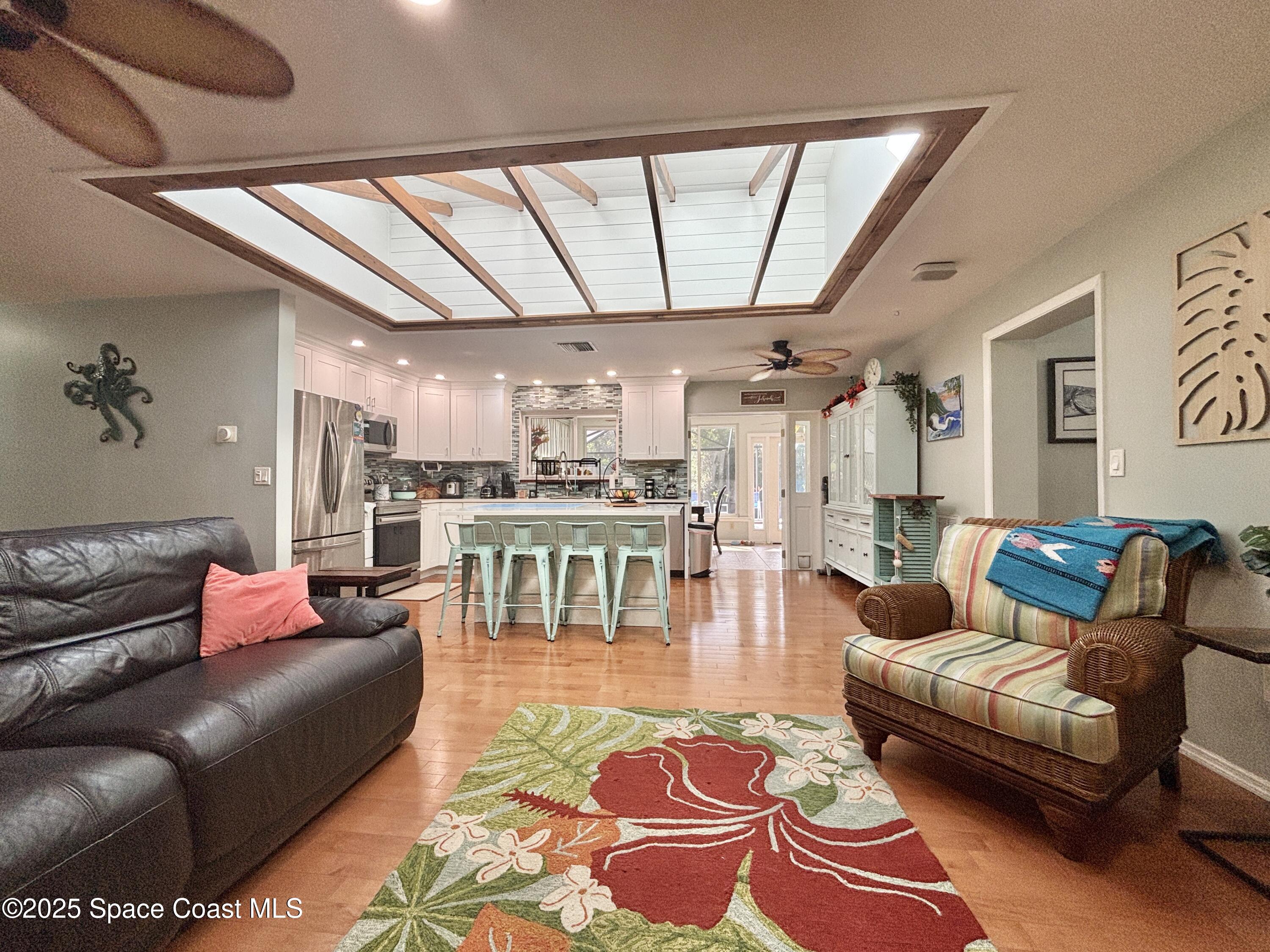 3955 Fooshe Avenue Sebastian, FL 32976 - Photo 43 of 45 a living room with furniture and a large window