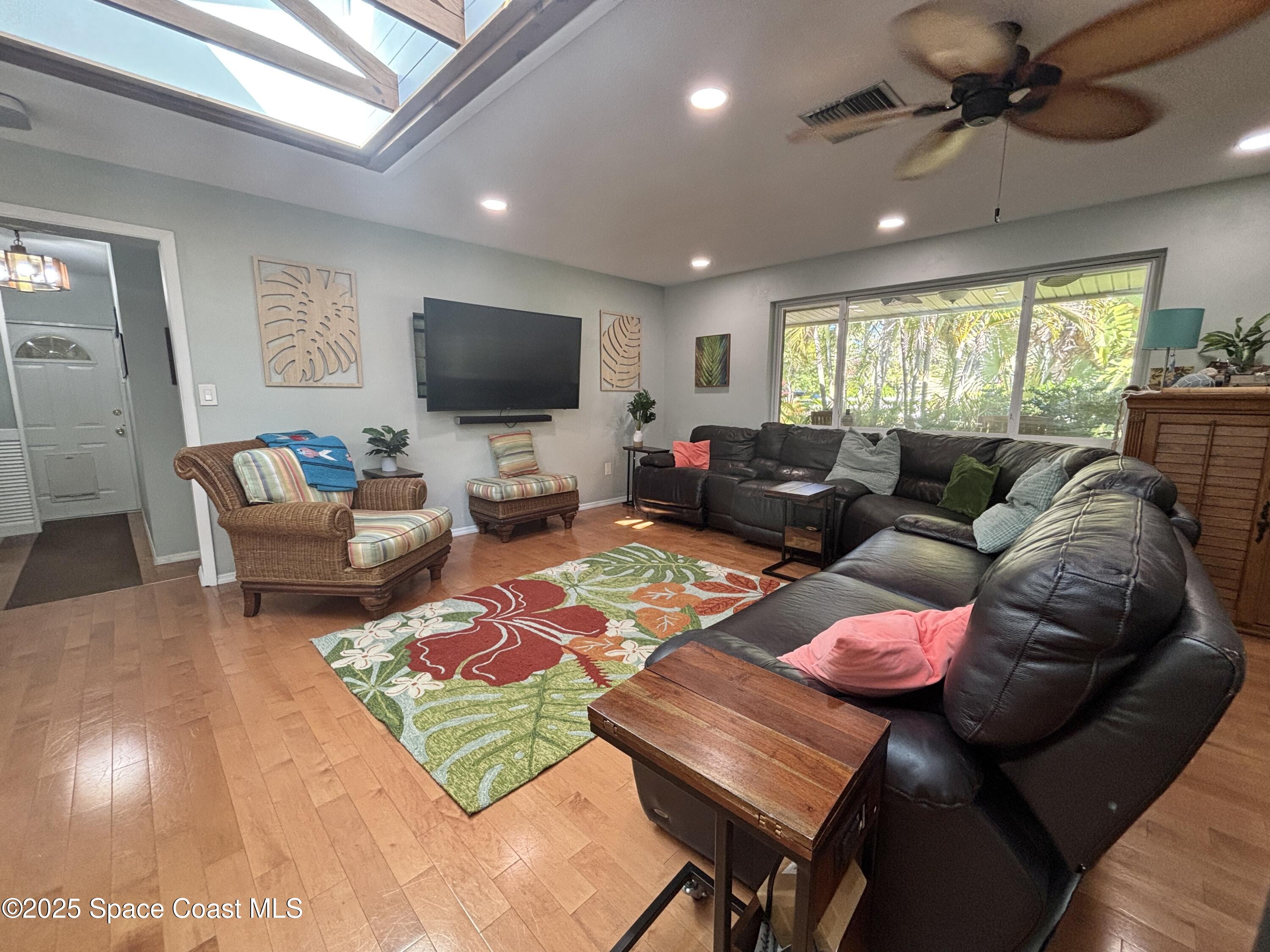 3955 Fooshe Avenue Sebastian, FL 32976 - Photo 7 of 45 a living room with furniture and a flat screen tv