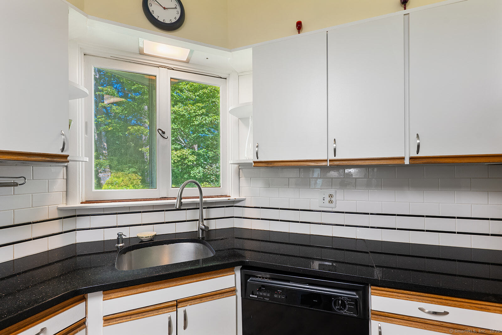 26 Wilridge Road Ridgefield, CT 06877 - Photo 10 of 40 a kitchen with a sink and a large window
