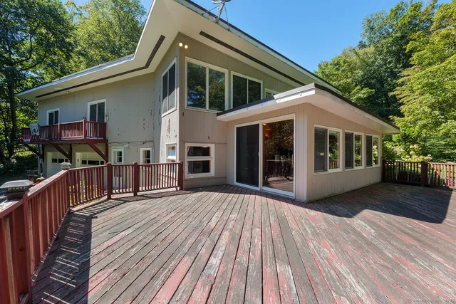 a view of a house with a roof deck