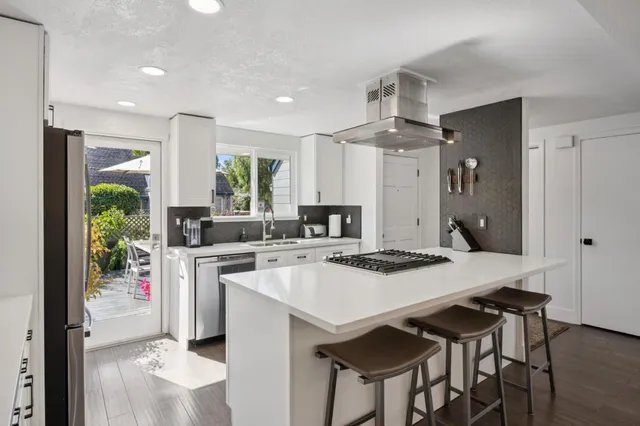 a view of a workspace with furniture