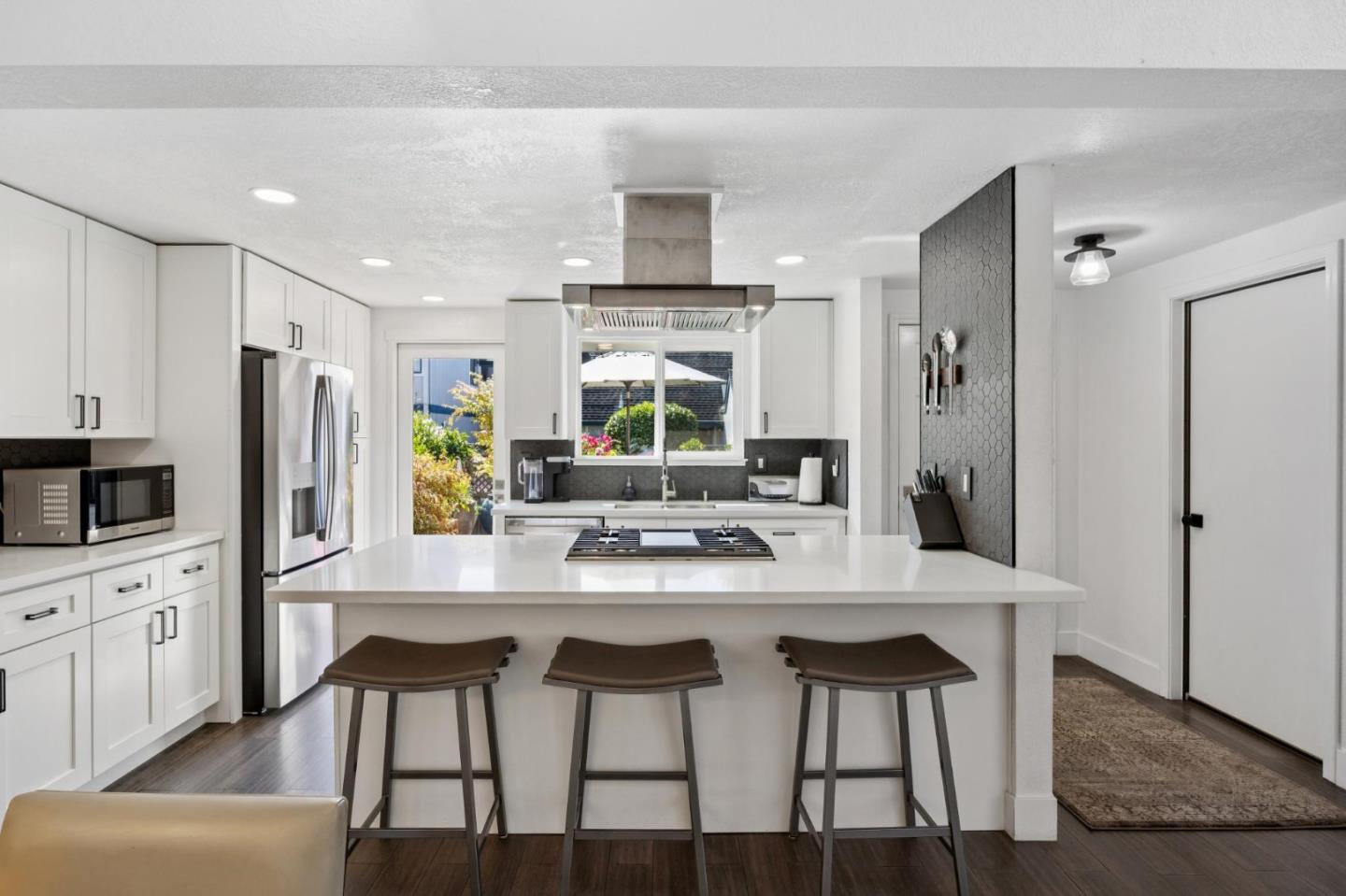 2601 Mallory Lane Santa Cruz, CA 95065 - Photo 15 of 52 a kitchen with stainless steel appliances a dining table chairs refrigerator and sink