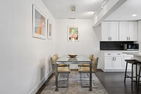 a view of a workspace with furniture and lounge chair