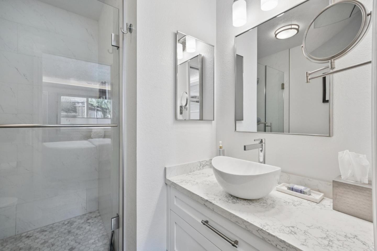 2601 Mallory Lane Santa Cruz, CA 95065 - Photo 30 of 52 a spacious bathroom with a granite countertop sink and a mirror