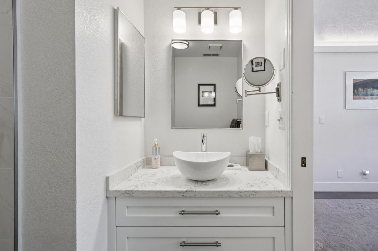 2601 Mallory Lane Santa Cruz, CA 95065 - Photo 31 of 52 a bath room with a sink and a mirror