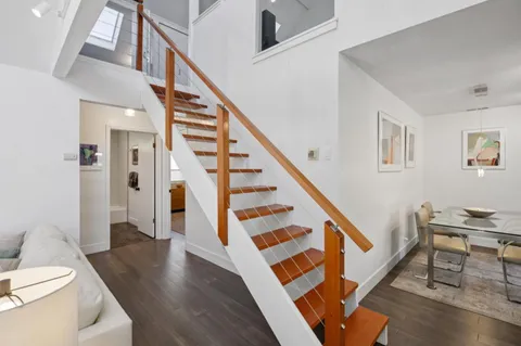 a living room with furniture and a rug
