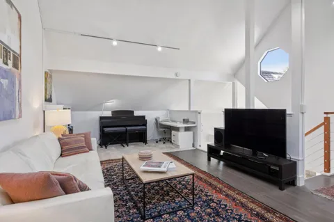 a view of a workspace with furniture