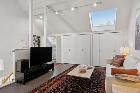 a view of hallway with wooden floor