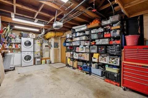a view of a chairs and table in the back yard of the house