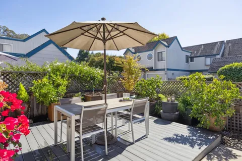 a view of a table and chairs in patio