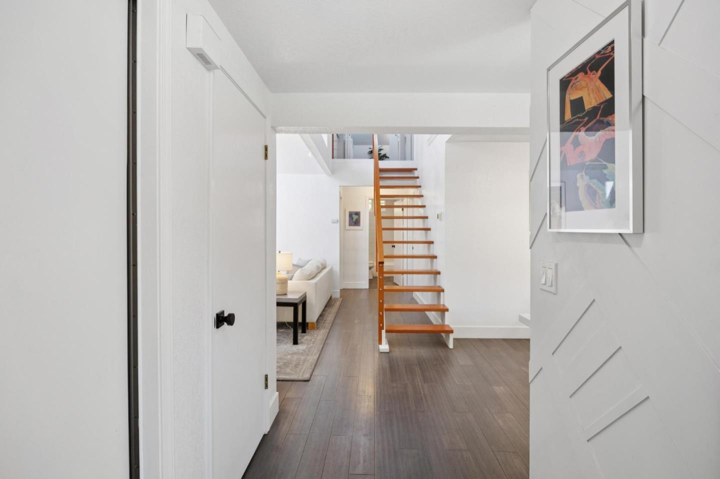 2601 Mallory Lane Santa Cruz, CA 95065 - Photo 8 of 52 an empty room with wooden floor and windows