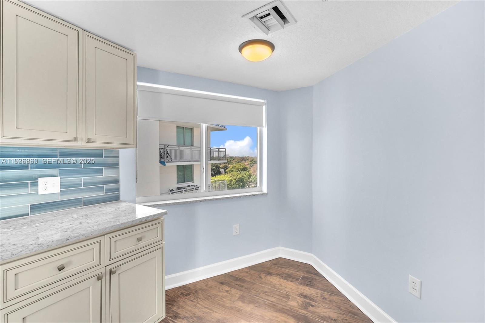 280 Southwest 20th Road, Unit 904 Miami, FL 33129 - Photo 18 of 36 a kitchen with a sink cabinets and window