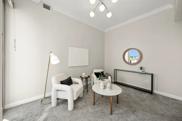 a living room with furniture and a chair