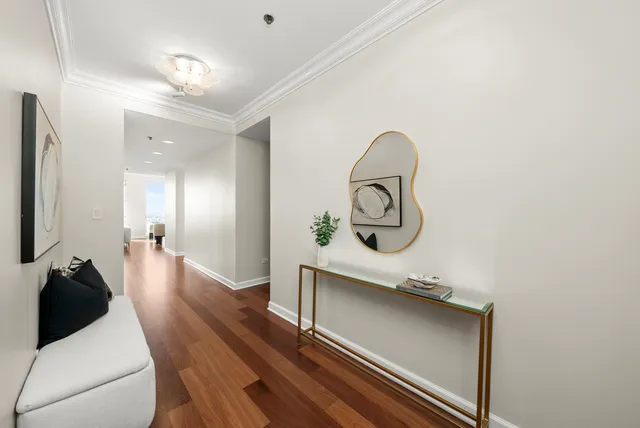a view of a roof deck with couches and potted plants