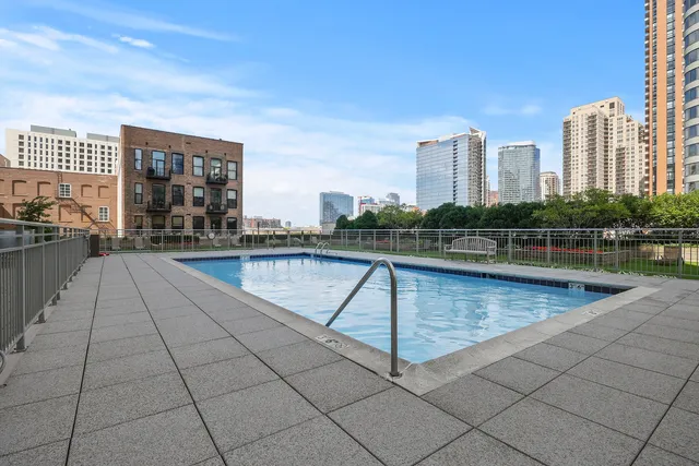 a view of a building with a backyard and plants