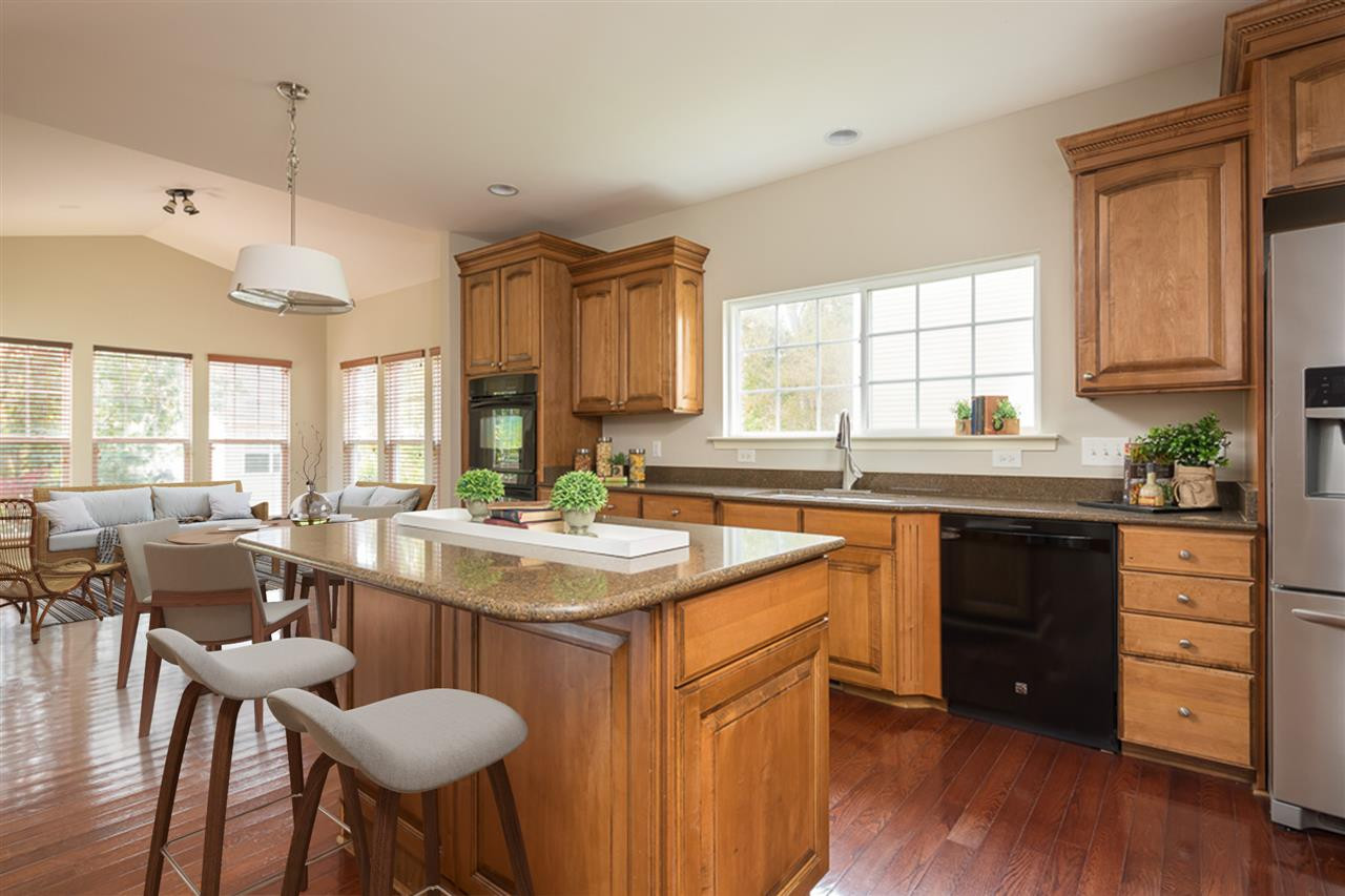 159 Locke Woods Road Raleigh, NC 27603 - Photo 2 of 17 Eat in Kitchen and sun room with LARGE windows let in so much natural light. Enjoy a great view of the private back yard! Kitchen