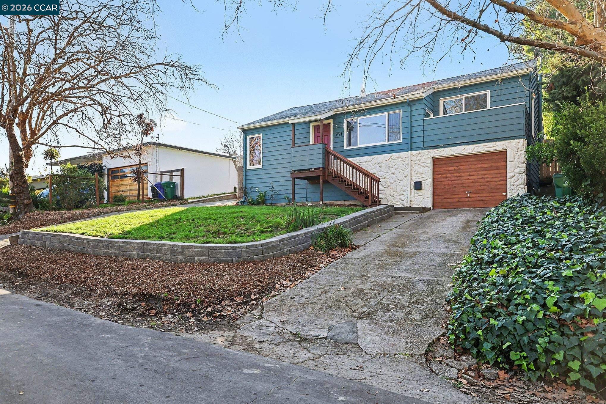 691 Rincon Road El Sobrante, CA 94803 - Photo 3 of 30 a front view of a house with garden