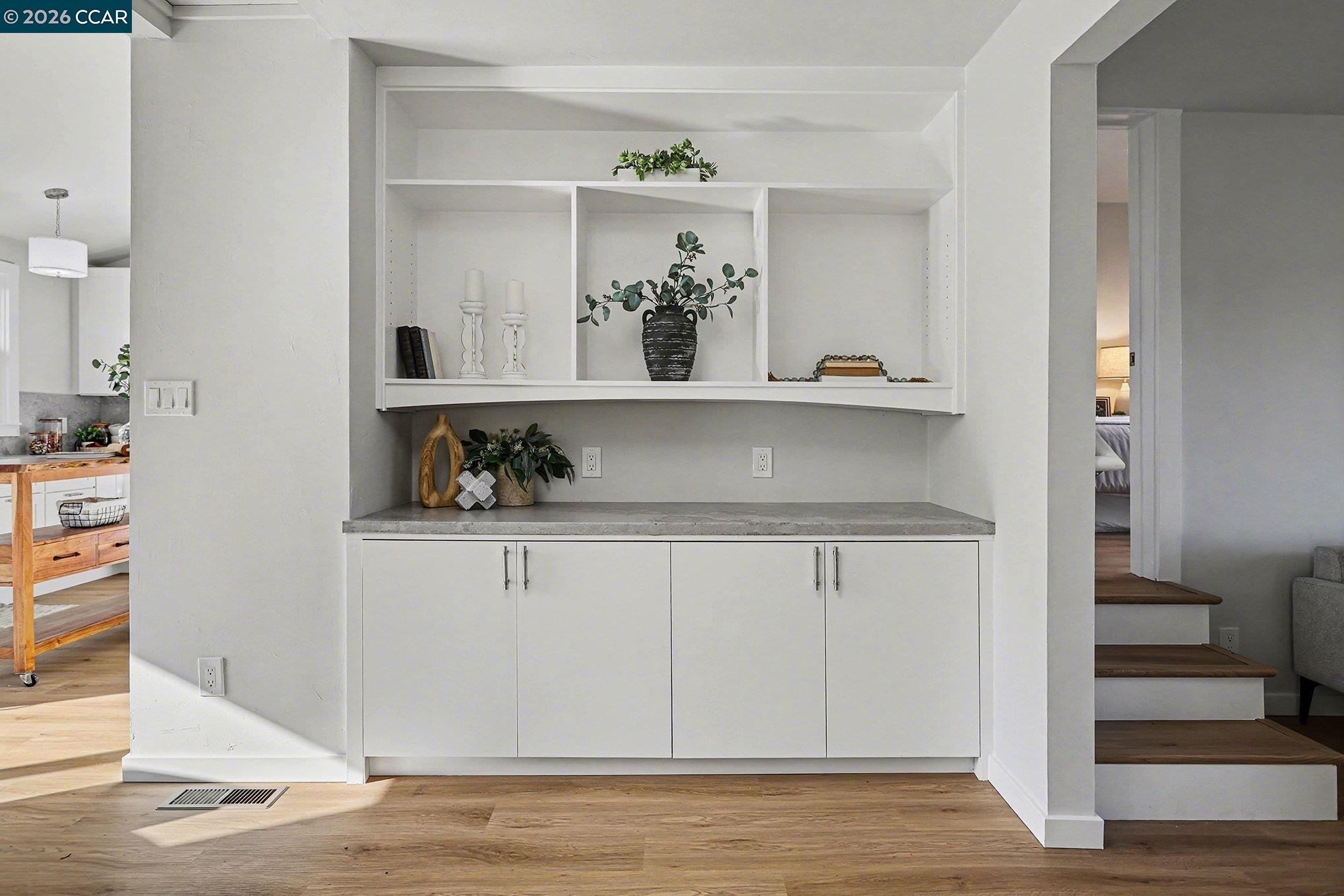 691 Rincon Road El Sobrante, CA 94803 - Photo 8 of 30 a view of white cabinets and wooden floor