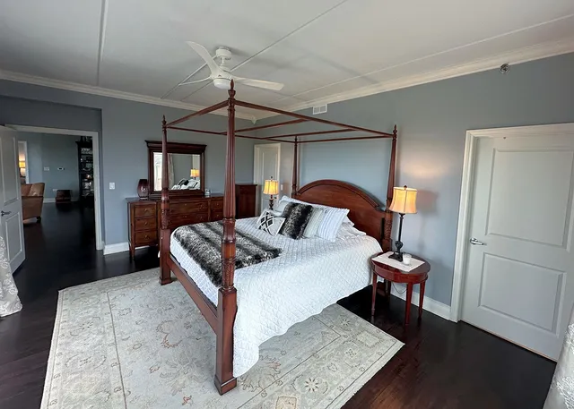 a balcony with chairs and a table