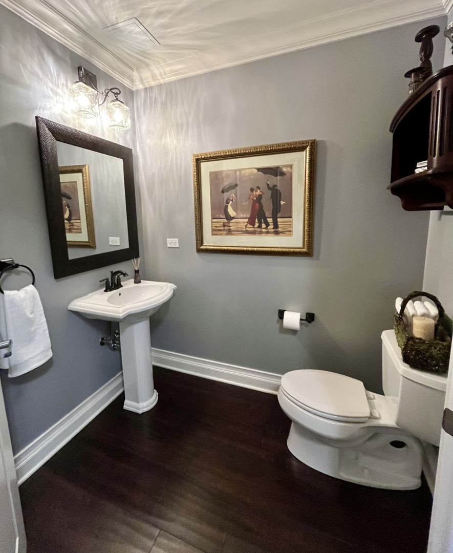 1199 East Port Clinton Road, Unit 304 Vernon Hills, IL 60061 - Photo 25 of 29 a bathroom with a toilet a sink and mirror