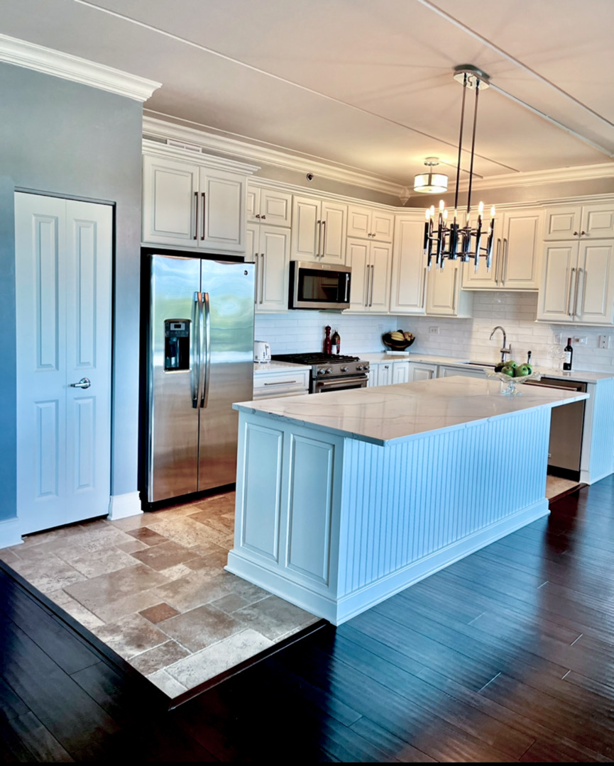 1199 East Port Clinton Road, Unit 304 Vernon Hills, IL 60061 - Photo 6 of 29 a kitchen with a sink refrigerator and cabinets