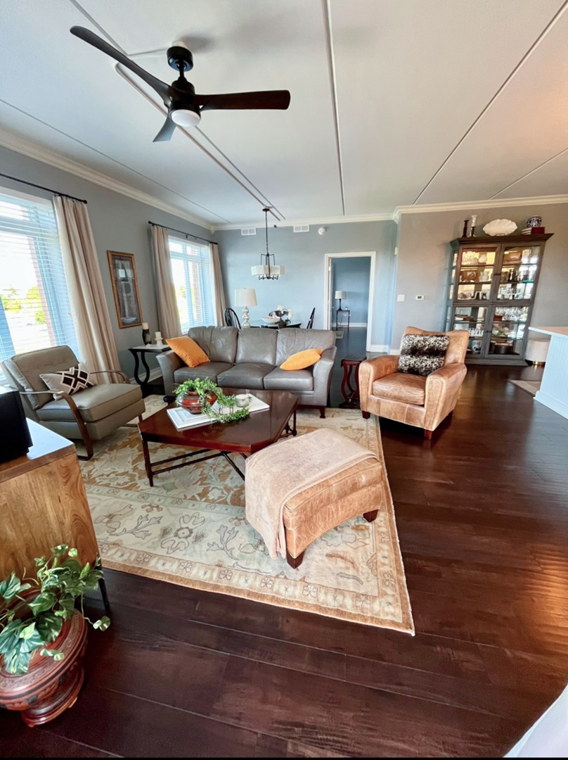 1199 East Port Clinton Road, Unit 304 Vernon Hills, IL 60061 - Photo 9 of 29 a living room with furniture and a potted plant