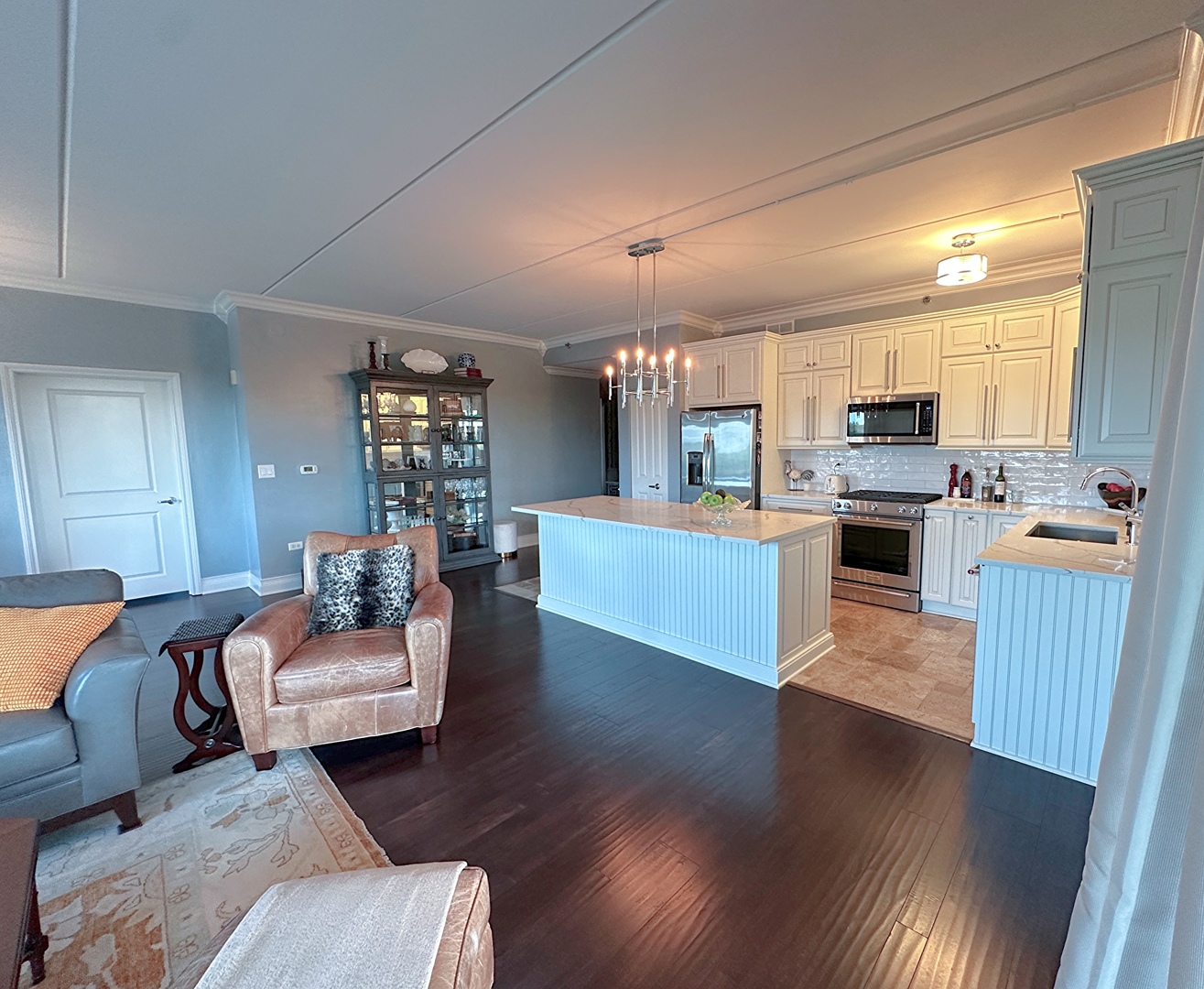 1199 East Port Clinton Road, Unit 304 Vernon Hills, IL 60061 - Photo 10 of 29 a living room with furniture and kitchen view