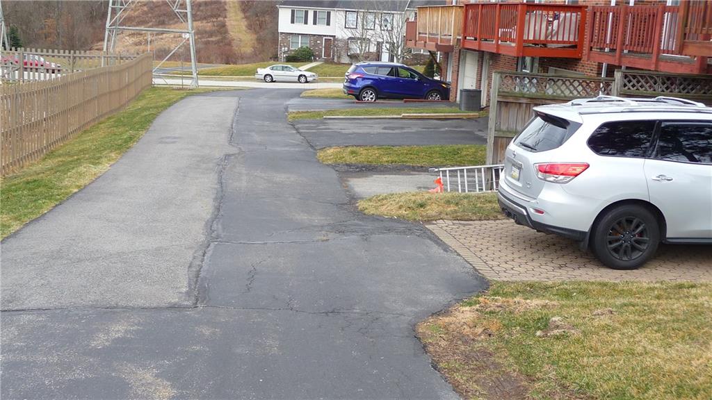 380 Shady Ridge Drive Monroeville, PA 15146 - Photo 21 of 21 Driveway leading behind all the units and picture of parking spot for this unit